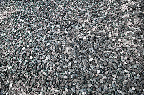 Pattern grey gravel granite texture background for mix rock concrete pattern in construction industrial. Small gray pebble on ground or floor. Vintage and retro. Close up.