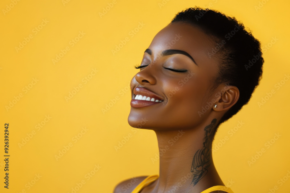 A close up of a tattooed black woman's face with her eyes closed A close up of a tattooed black woman's face with her eyes closed