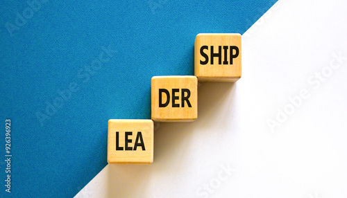 Leadership symbol. Concept word Leadership on beautiful wooden blocks. Beautiful white and blue background. Business leadership concept. Copy space.