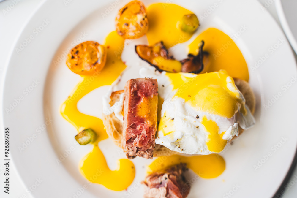 Brunch of toast with tuna and egg benedict on a white background. Selected focus. High quality photo