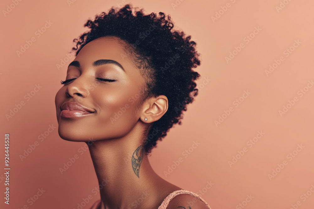 A close up of a tattooed black woman's face with her eyes closed A close up of a tattooed black woman's face with her eyes closed