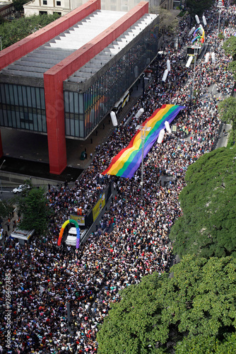 Revelers fill the streets holding a giant rainbow flag during the annual Gay Pride parade in Paulista avenue, Sao Paulo, Brazil.