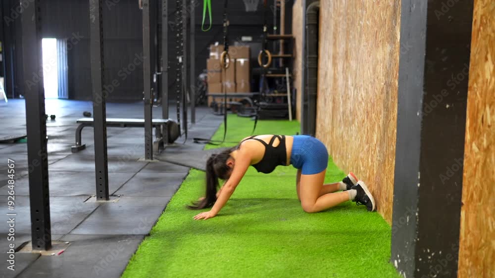 Video of a female beauty fit Chinese athlete warming up in a cross training gym Video of a female beauty fit Chinese athlete warming up in a cross training gym