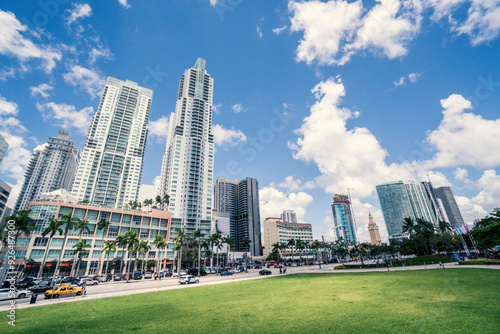 Miami Florida Downtown Building Skyline with Skyscraper buildings Condos Infront of Park with Green Grass