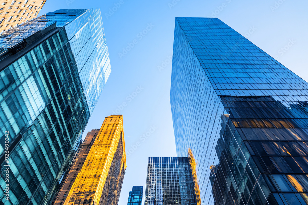 A city skyline with tall buildings and a clear blue sky A city skyline with tall buildings and a clear blue sky