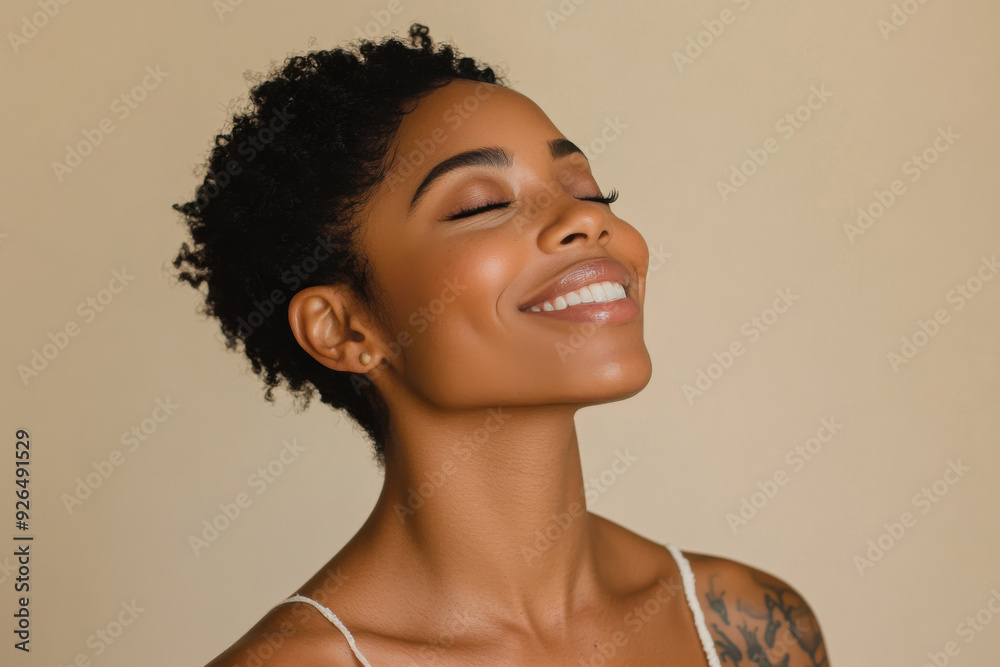 A close up of a tattooed black woman's face with her eyes closed