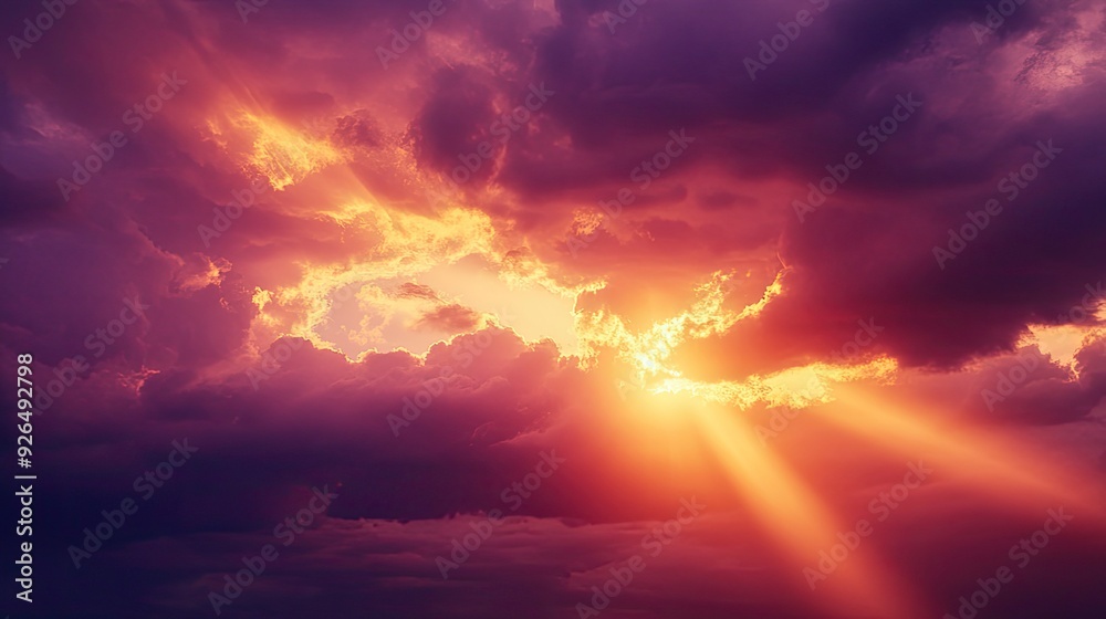 Dramatic sunset with storm clouds and sunlight breaking through, casting rays of gold and purple across the sky. Dramatic sunset with storm clouds and sunlight breaking through, casting rays of gold and purple across the sky.