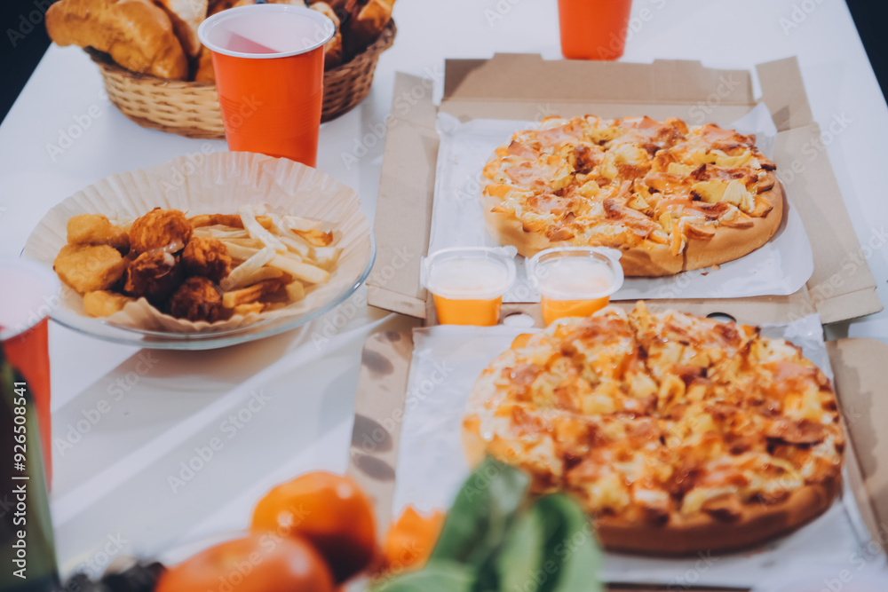 Group of young friends eating pizza.Home party. Group of young friends eating pizza.Home party.