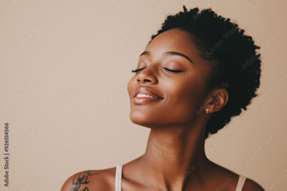 A close up of a tattooed black woman's face with her eyes closed A close up of a tattooed black woman's face with her eyes closed