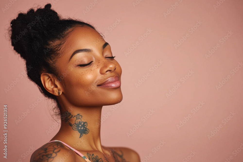 A close up of a tattooed black woman's face with her eyes closed A close up of a tattooed black woman's face with her eyes closed