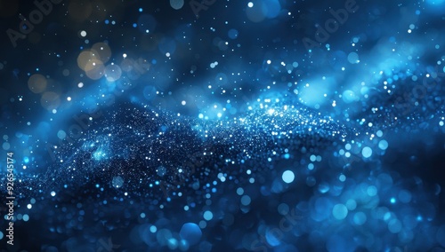 Abstract blue and white bokeh lights creating a dreamy, starry night effect.