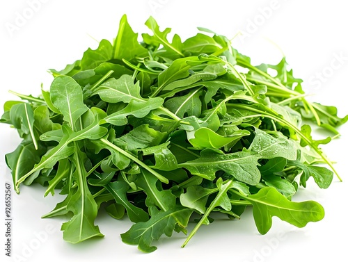 Fresh arugula leaves arranged on a white surface, showcasing vibrant green color and crisp texture