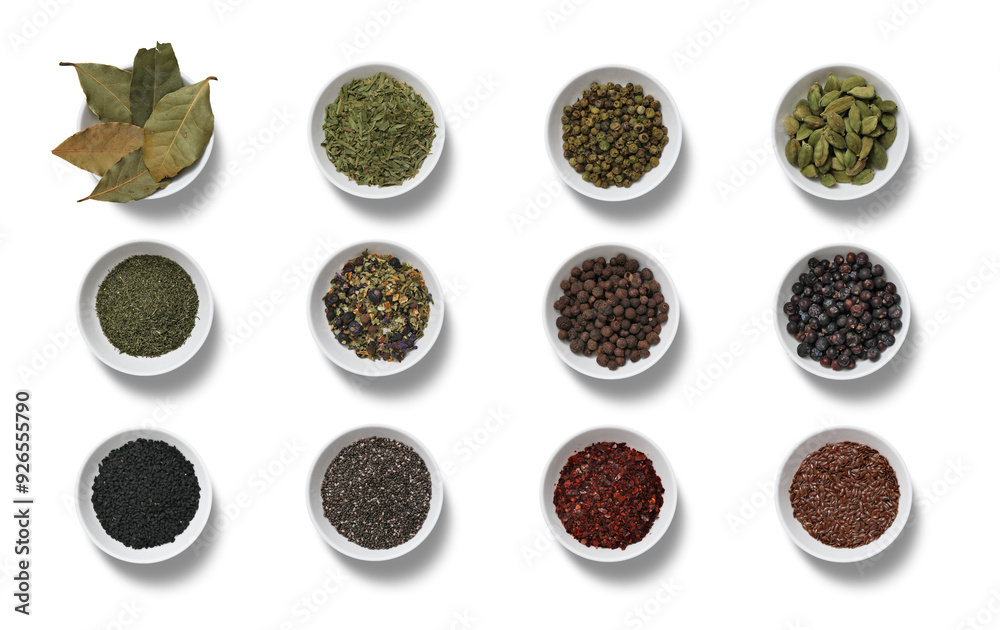 Various spices and herbs displayed in small bowls, showcasing their colors and textures on a clean, white background Various spices and herbs displayed in small bowls, showcasing their colors and textures on a clean, white background