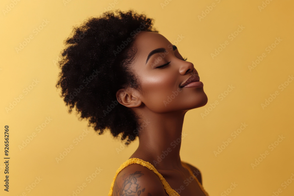 A close up of a tattooed black woman's face with her eyes closed A close up of a tattooed black woman's face with her eyes closed