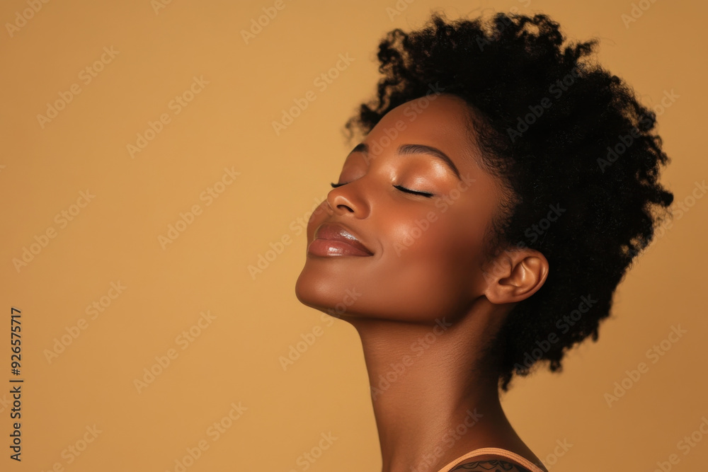 A close up of a tattooed black woman's face with her eyes closed A close up of a tattooed black woman's face with her eyes closed