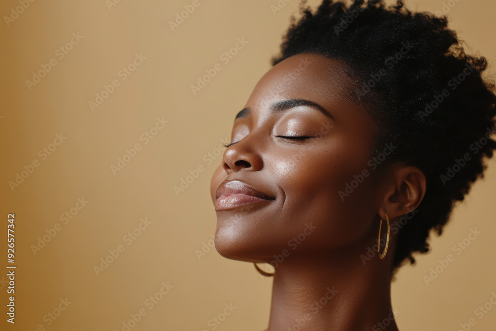 A close up of a tattooed black woman's face with her eyes closed A close up of a tattooed black woman's face with her eyes closed