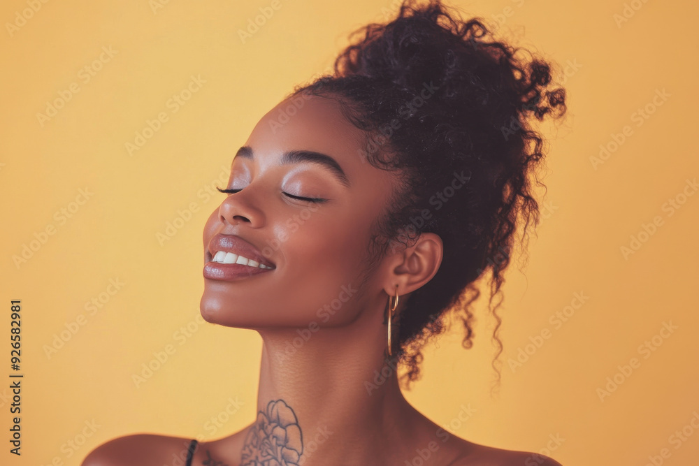 A close up of a tattooed black woman's face with her eyes closed A close up of a tattooed black woman's face with her eyes closed