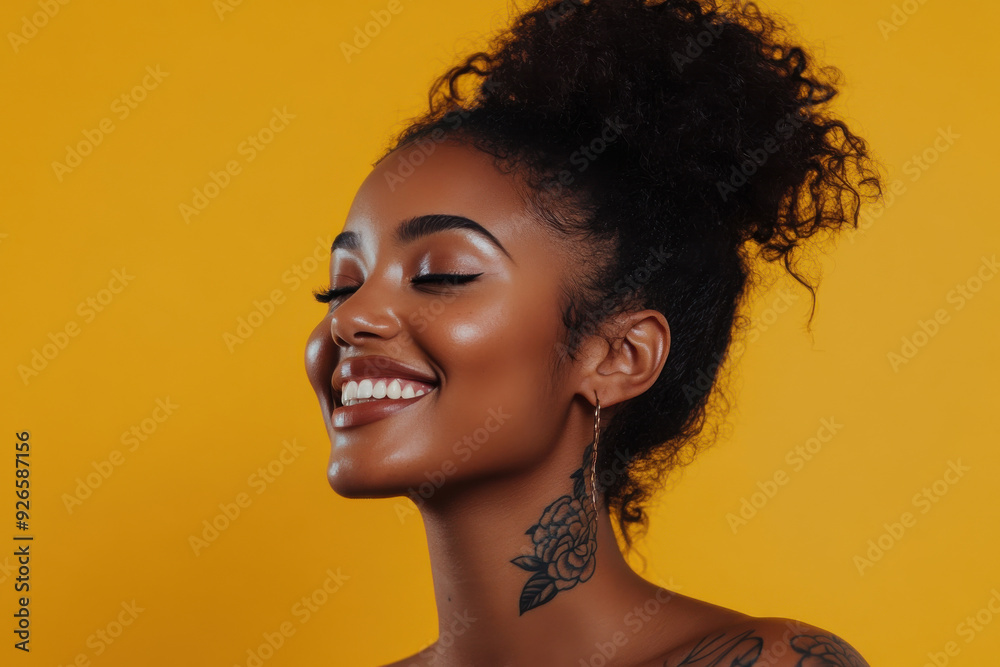 A close up of a tattooed black woman's face with her eyes closed A close up of a tattooed black woman's face with her eyes closed