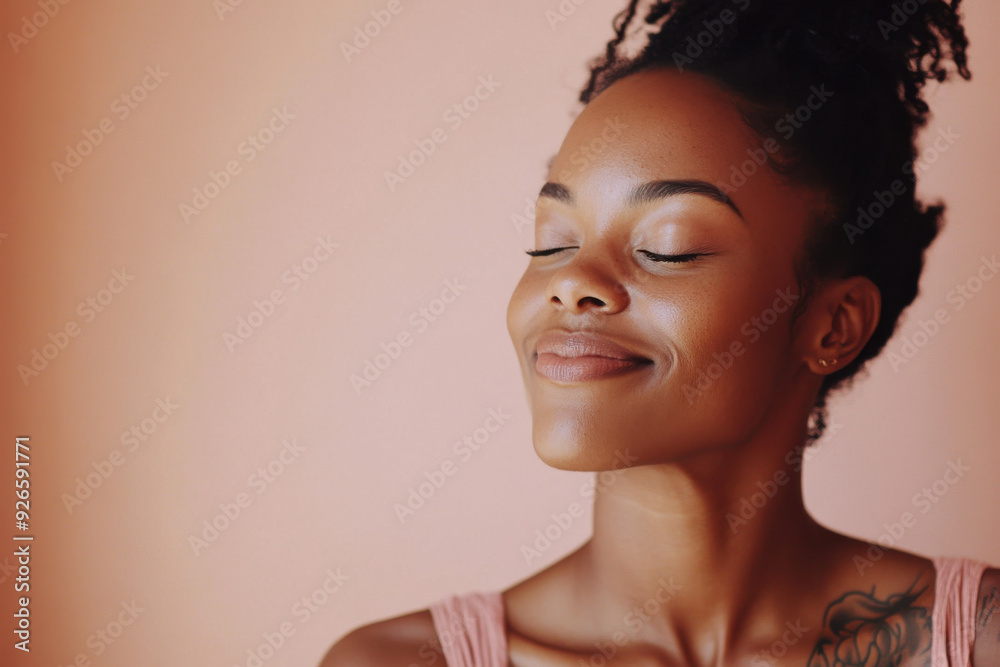 A close up of a tattooed black woman's face with her eyes closed A close up of a tattooed black woman's face with her eyes closed