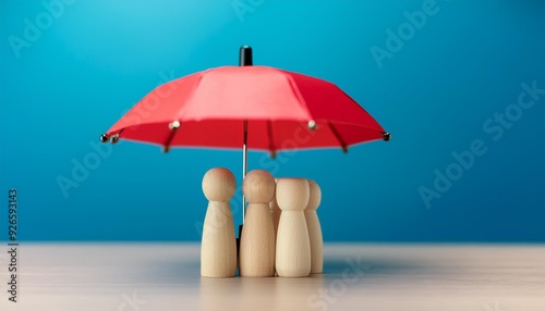 Wallpaper Mural Red toy umbrella protects wooden dolls from the blue backdrop. This represents insurance coverage. Torontodigital.ca