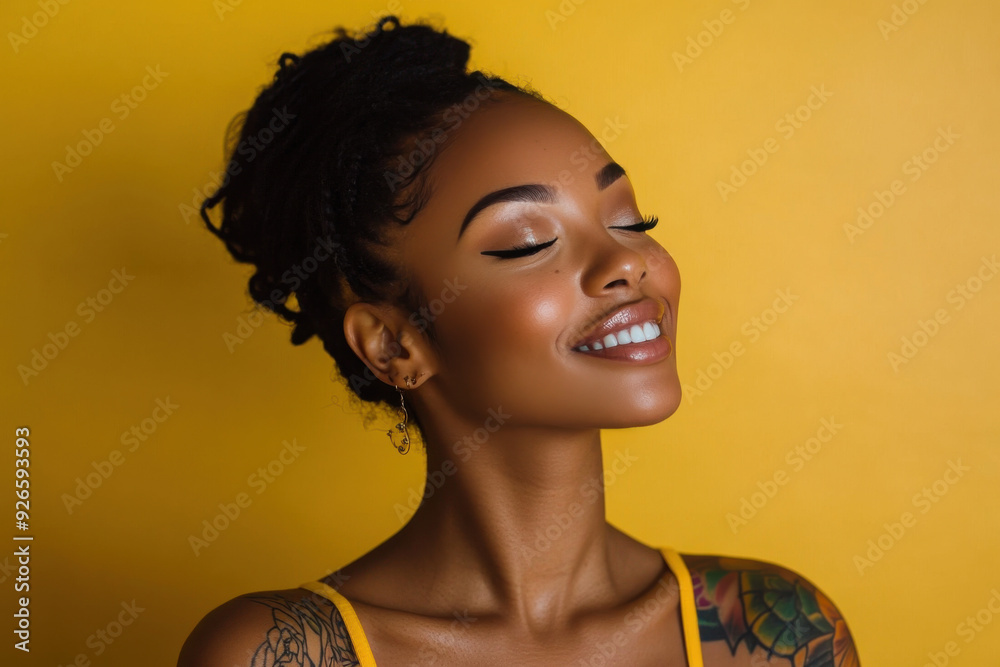 A close up of a tattooed black woman's face with her eyes closed A close up of a tattooed black woman's face with her eyes closed