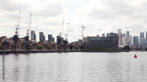 Waterfront dockland housing along Royal Docks. London, UK, 28 July 2024 photo