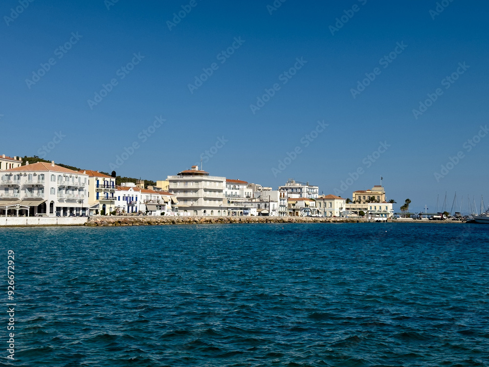 Spetses island, Greece. Seafront buildings view from the sea Spetses island, Greece. Seafront buildings view from the sea