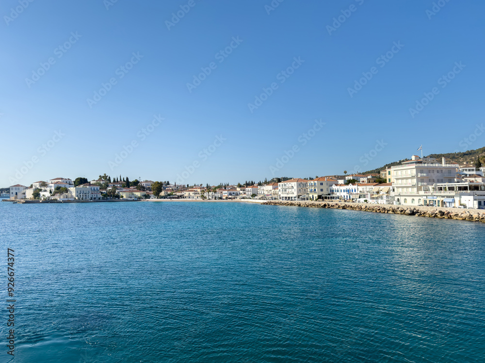 Fototapeta premium Spetses island, Greece. Seafront buildings view from the sea