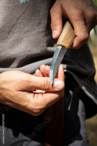 hands of a person and a knife