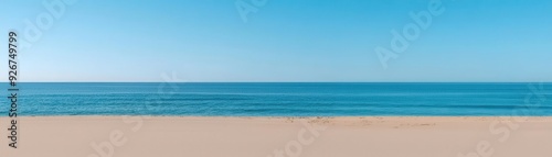 Labor Day outdoor nap on a beach, with a person resting on a towel under an umbrella, enjoying the sound of the waves