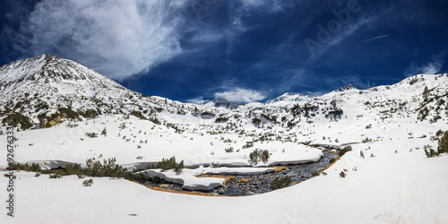 Early spring sunny day in Pirin national park. Bunderishka river valley during the snowmelt, Bansko, Bulgaria. photo