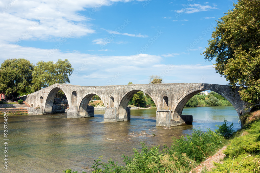 The famous stone bridge over the river Arachthos, in Arta, Greece The famous stone bridge over the river Arachthos, in Arta, Greece