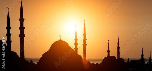 Islamic mosque at sunset silhouette background. Muslim city and architecture concept photo