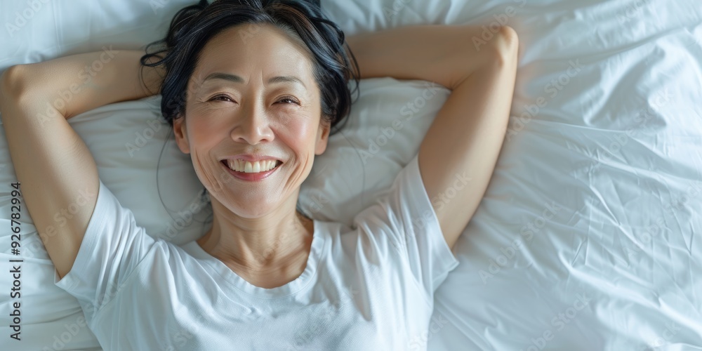 Older woman sleeping, thinking, and cheerful for stress alleviation, morning wellbeing, or retirement relaxation. Japanese man relaxes, daydreams, or smiles in home bedroom. Older woman sleeping, thinking, and cheerful for stress alleviation, morning wellbeing, or retirement relaxation. Japanese man relaxes, daydreams, or smiles in home bedroom.