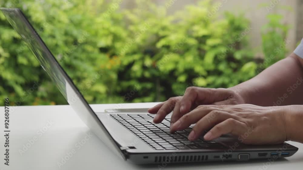 Close up of freelancer's developer hands typing program code on laptop keyboard in coworking. Businessman at work in working in cafe. Copywriter writing text on computer keyboard in coffee shop.