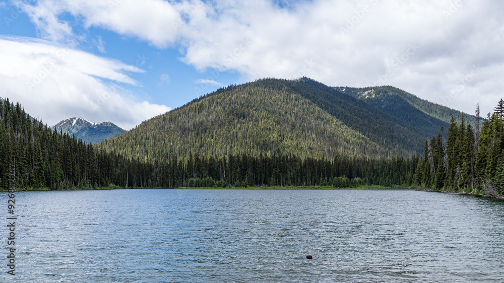 Beautiful waters of the Lightning Lake at Manning Park British Columbia Canada with clouds over the mountains Beautiful waters of the Lightning Lake at Manning Park British Columbia Canada with clouds over the mountains