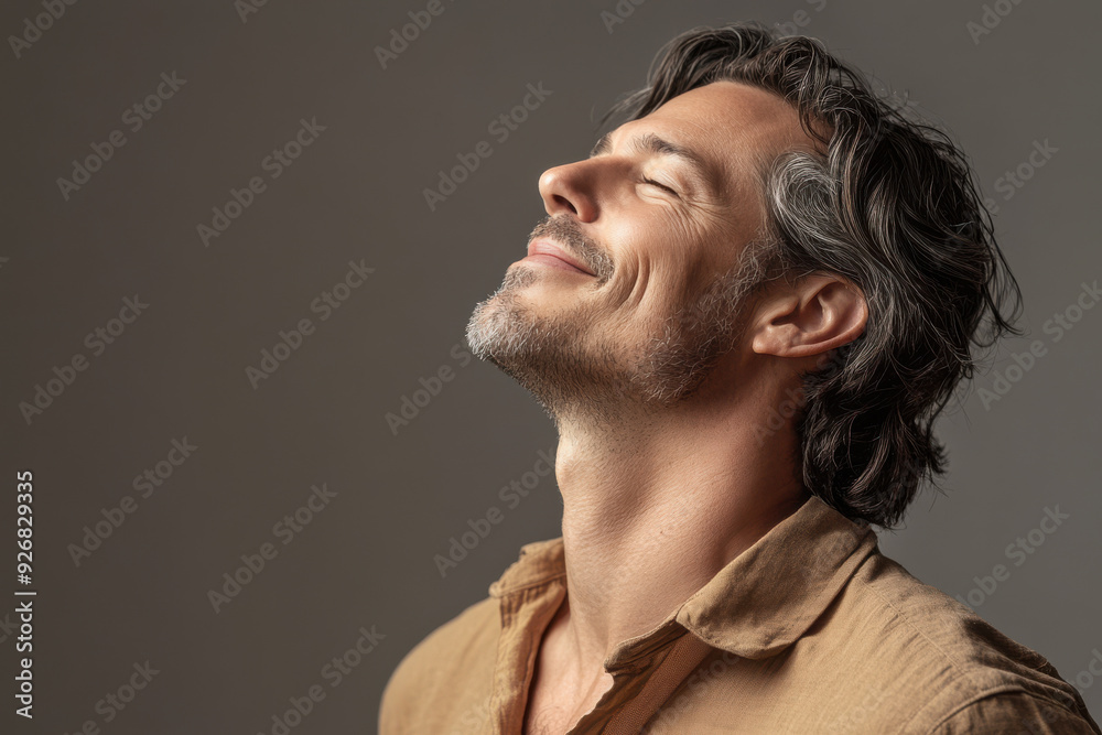 A close up of a man's face with her eyes closed A close up of a man's face with her eyes closed
