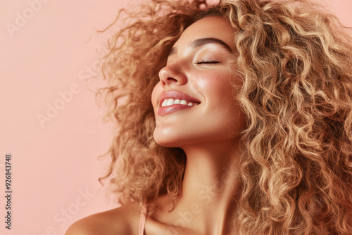 A close up of a woman's face with her eyes closed and long blond hair