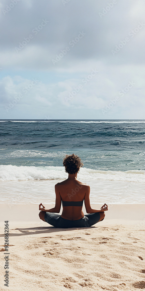 Fototapeta premium Relaxed person meditating on a sandy beach