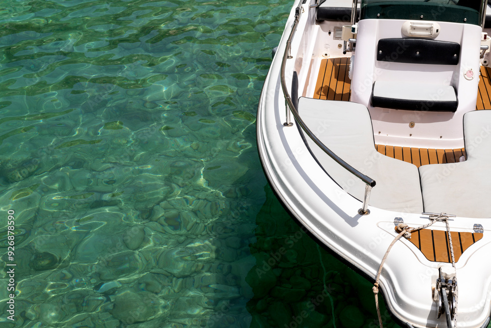 Obraz premium Bow of a luxury boat tied to a pier.