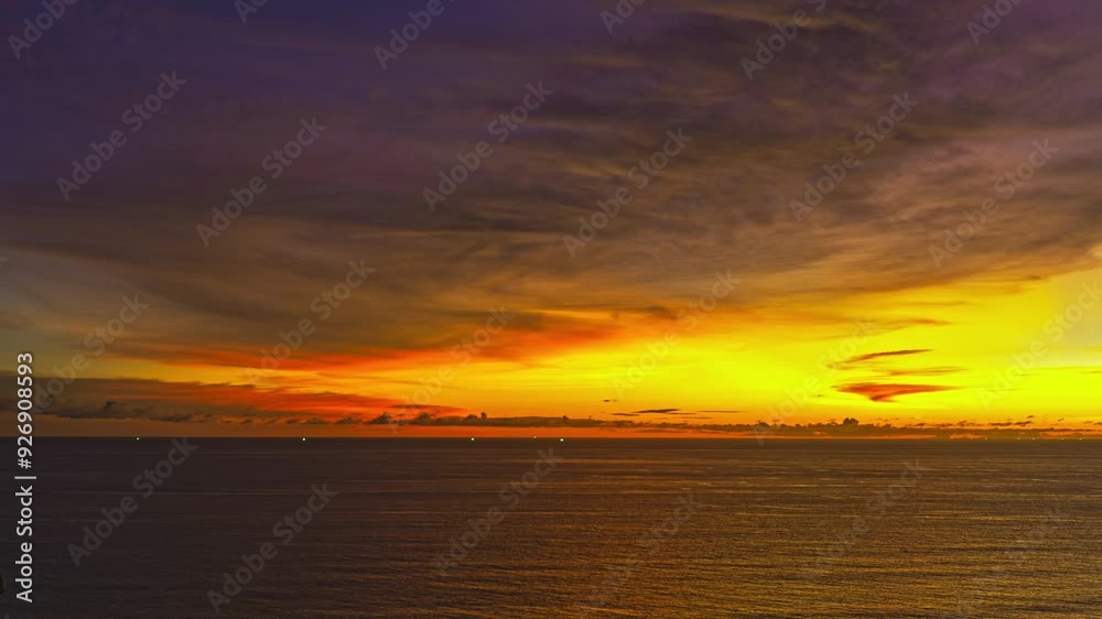 Aerial hyperlapse The golden reflection of the sun on the vast ocean. The sun's rays cast a warm glow on the landscape. The sky is ablaze with color. Golden waves at sunset as a background Aerial hyperlapse The golden reflection of the sun on the vast ocean. The sun's rays cast a warm glow on the landscape. The sky is ablaze with color. Golden waves at sunset as a background