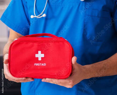 Male doctor with first aid bag