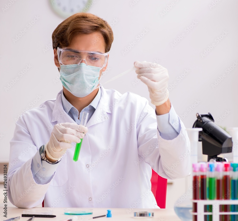Young chemist working in the lab Young chemist working in the lab