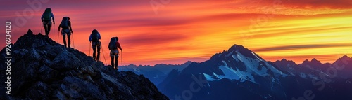 A group of hikers silhouetted against a vibrant sunset over a mountain range, capturing the essence of adventure and nature.