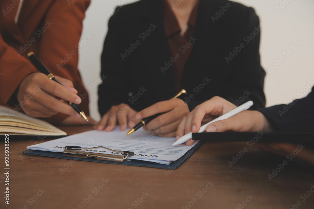 Lawyer, legal advisor, businessman brainstorming information on agreement details Business contracts in legal processing books for accuracy in contract documents. joint financial investment. Lawyer, legal advisor, businessman brainstorming information on agreement details Business contracts in legal processing books for accuracy in contract documents. joint financial investment.