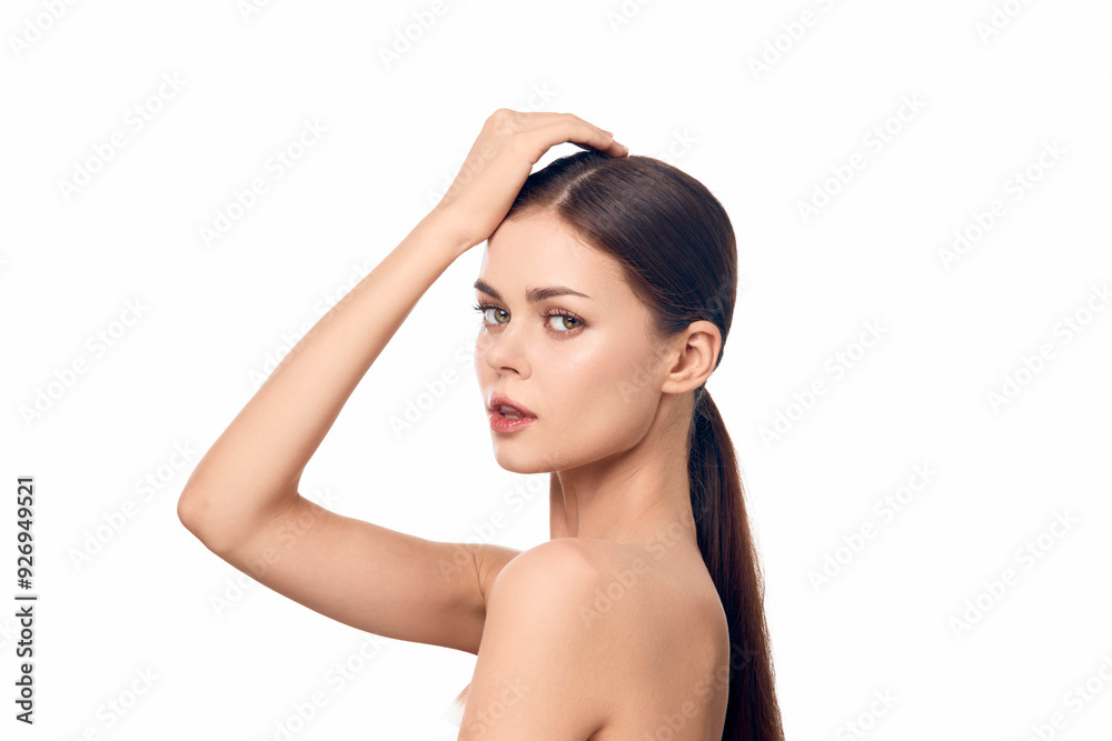 Beautiful woman with long hair touching her head on a white background Beautiful woman with long hair touching her head on a white background