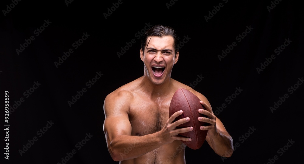 Obraz premium Ripped muscular man with american football