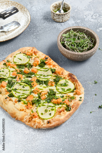 Roman Pizza with Zucchini and Salmon Toppings on Rustic Background photo