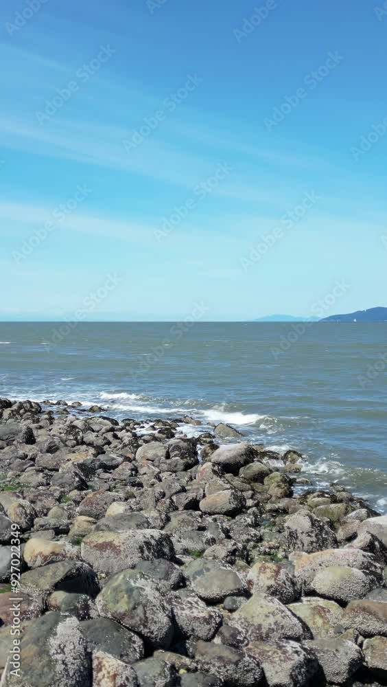 Ocean Coast, Rocky Shore, blue sky. British Columbia, Canada.