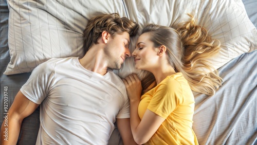  top view of a young couple lying face